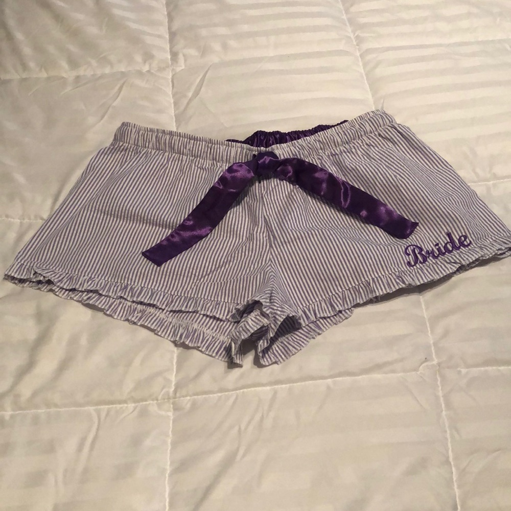 Purple and white striped seersucker shorts.